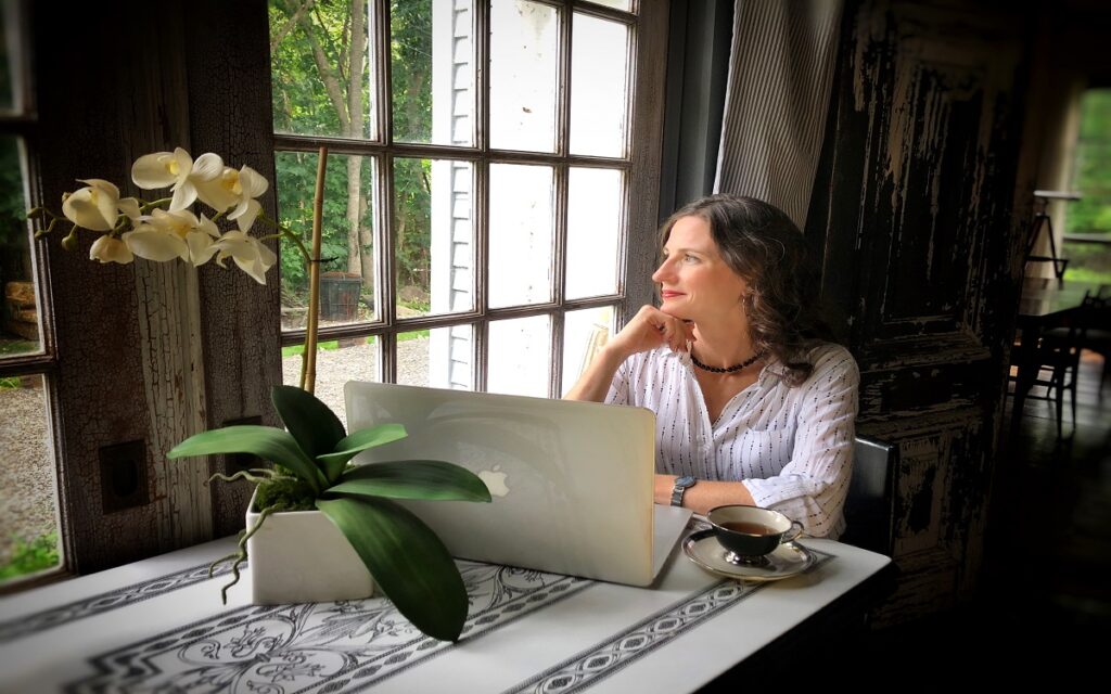 Woman business owner setting boundaries while working on laptop.