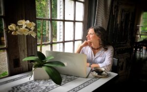Woman business owner setting boundaries while working on laptop.