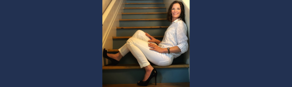 Woman sitting confidently on staircase in heels, symbolizing women leaders investing in themselves and stepping beyond bootstrapping