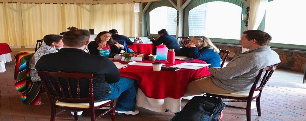 Women leaders selling at events engaged in meaningful discussion at a professional workshop