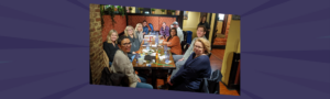 Women leaders gathered around a table during lunch break at Nettie Owens' planning workshop, showing the connection and engagement created through intentional event design.