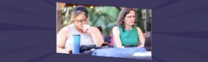 Two women leaders experiencing decision fatigue, showing signs of mental exhaustion and cognitive depletion during a professional event.