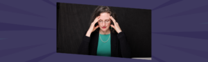 Woman leader experiencing leadership overwhelm at her desk