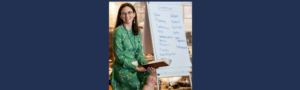 Nettie Owens presenting a 90-day plan framework on a whiteboard during Wake Up Women Leaders